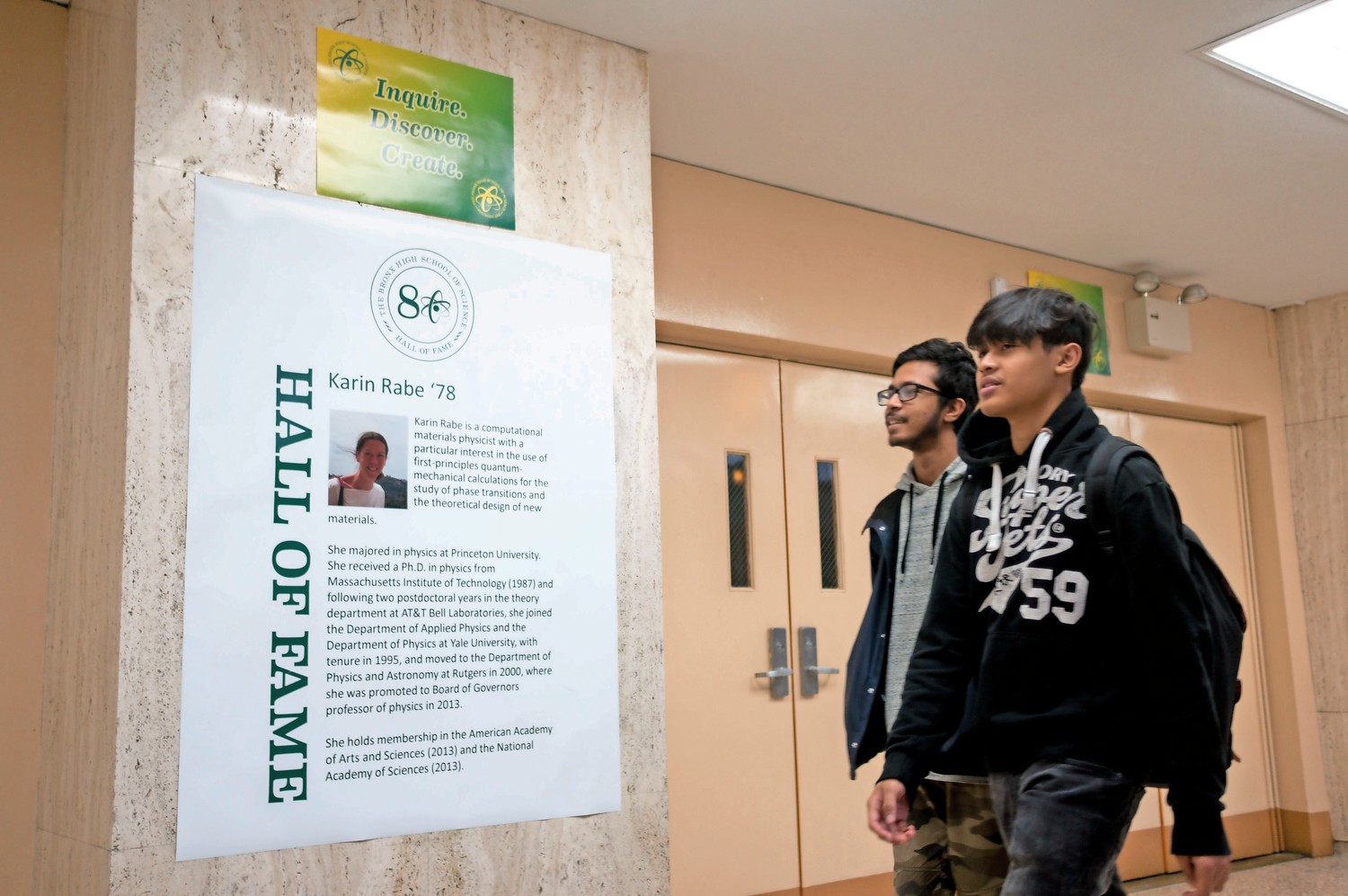 Students at the Bronx High School of Science walk past a hall of fame poster celebrating 1978 alumna Karin Rabe. Bronx Science recently unveiled a hall of fame to celebrate the school's notable alumni.
