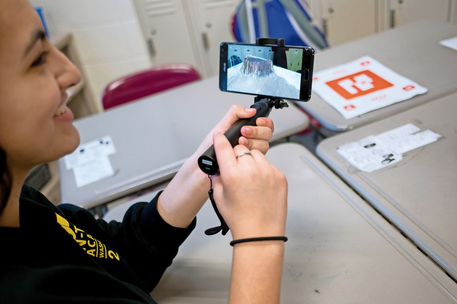 InTech student Amelie Nachtmann looks at a plateau on her phone through an augmented reality program from Google. The company came to the school to show students both augmented reality and virtual reality.