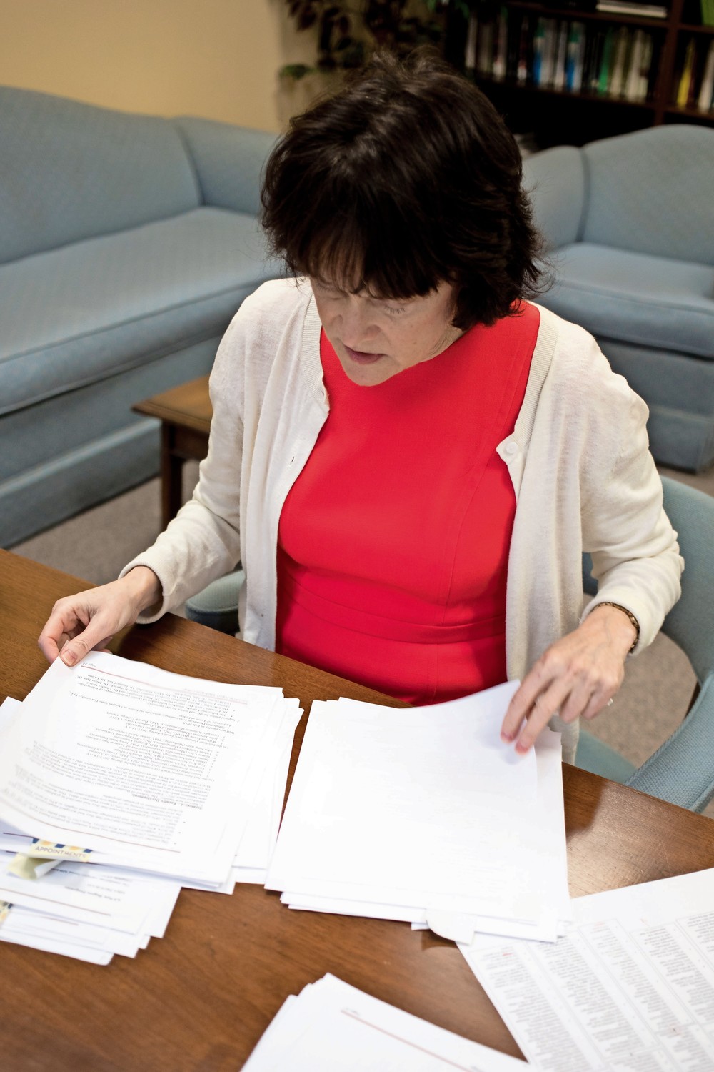 Janet Rovenpor, associate dean of Manhattan College?s School of Business, looks through paper work in a meeting with Aileen Farrelly, an assistant dean.