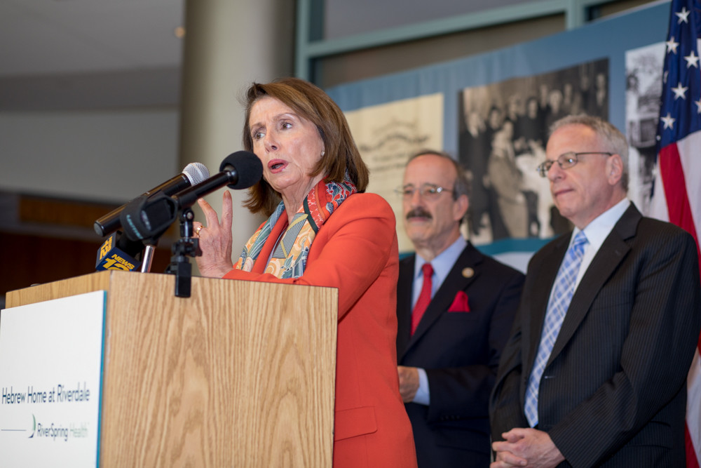 Former House Speaker Nancy Pelosi talks with residents of the Hebrew Home at Riverdale on Monday about the importance of health care and preventing legislative attacks against Medicare, Medicaid and the Affordable Care Act.