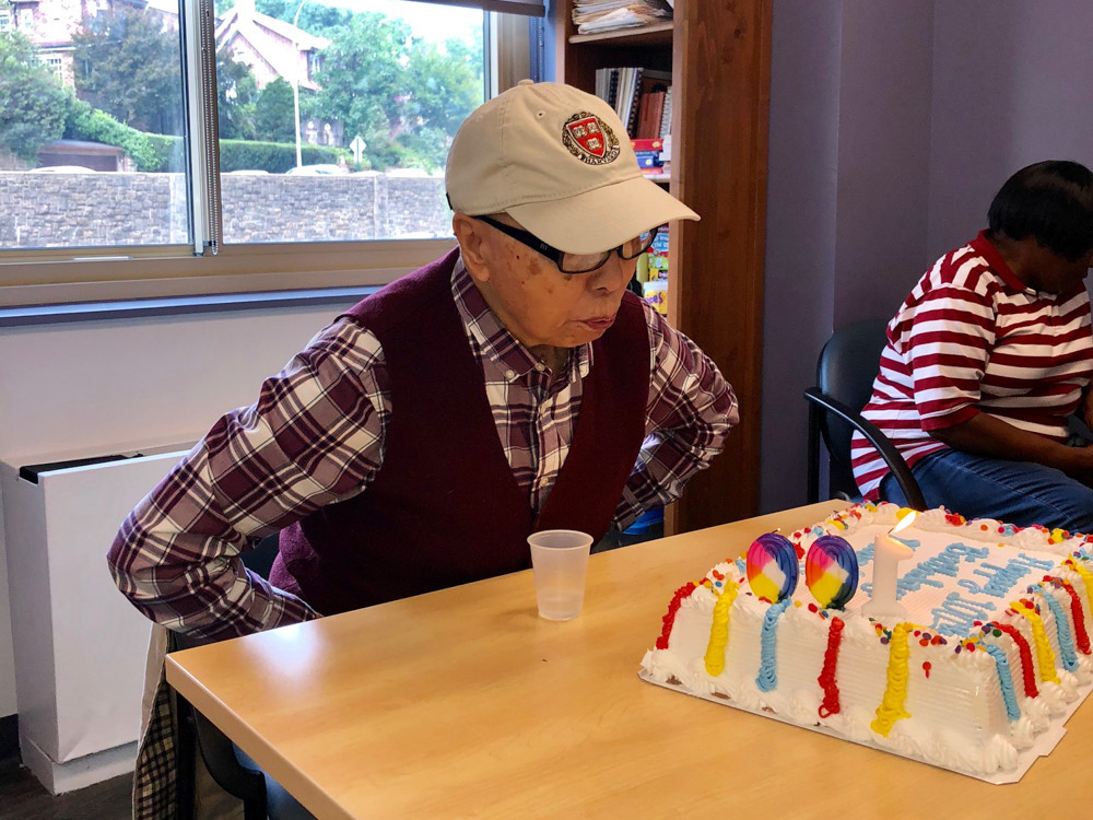 Ming Chin blows out the candle on his birthday cake at Riverdale Senior Services. Chin, who celebrated his 100th birthday Aug. 27, immigrated to the United States when he was 39. He then went on to get his master’s in civil engineering from Harvard University.