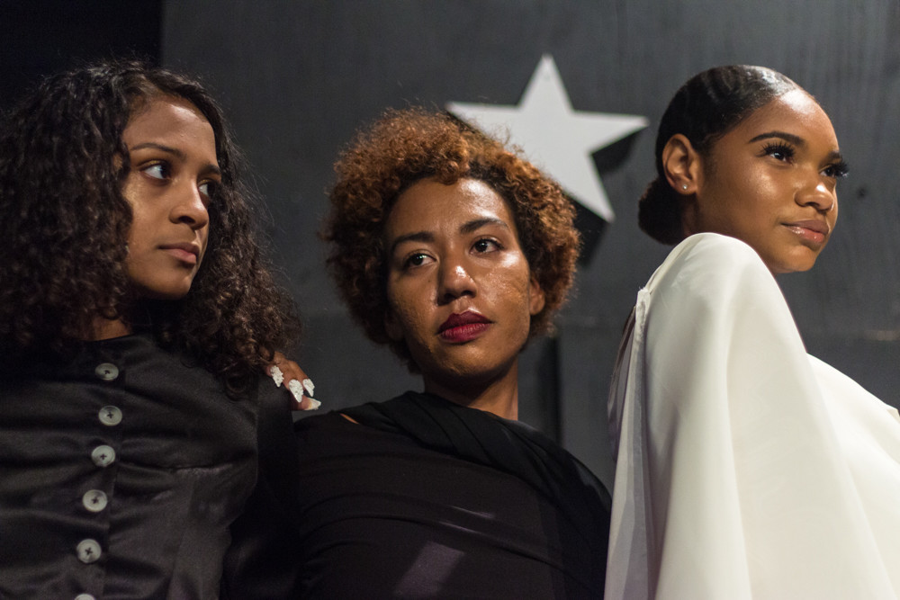 Models stand for photos during Edwin Reyes’s latest fashion show Sept. 14 at The Point. The show was in honor of Puerto Rico and was used to raise money for relief efforts in partnership with Siempre Contigo.