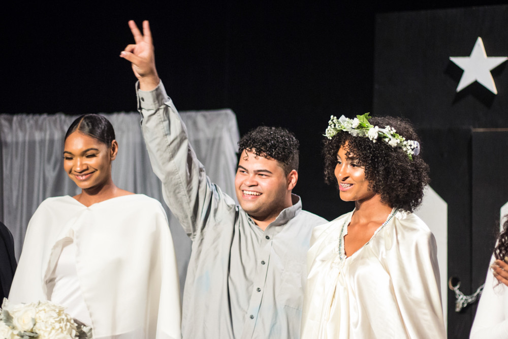 Fashion designer Edwin Reyes rejoices at the close of his third fashion show at The Point on Sept. 14. Reyes, 19, partnered with a non-profit to donate proceeds from the show to the ongoing relief efforts in Puerto Rico.