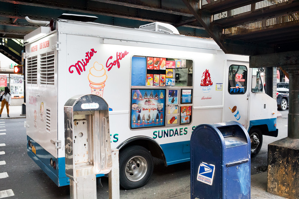 Victor Emmanuel has been driving a Mister Softee truck for three months after 17 years as a livery cab driver. Slinging soft serve, he says, offers more peace of mind, even if driving a cab paid better. Emmanuel hopes to one day purchase a Mister Softee truck of his own and pass it on to his children — a son, 21, who already drives his own ice cream route, and a daughter, 17, about to start college.
