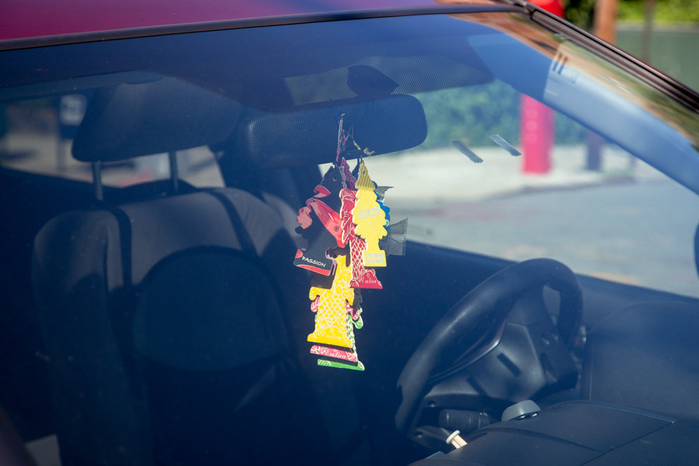 The mundane can occasionally be absurd, like a preponderance of air fresheners, one of which is labeled, ‘Passion,’ which can make its way into a photograph by Eian Kantor.