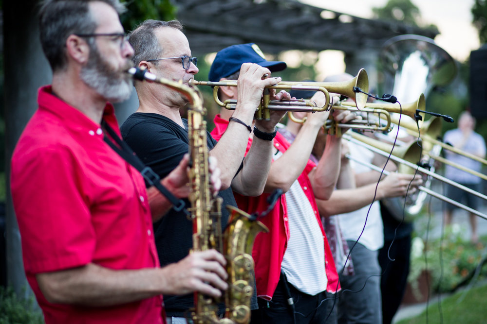 Slavic Soul Party, a nine-piece Balkan brass band, performs at Wave Hill in July. In addition to its large outdoor garden, Wave Hill is home to the Glyndor Gallery, and hosts performances like its Sunset Wednesdays summer concert series in an effort to provide art and entertainment to residents of the Bronx and beyond.
