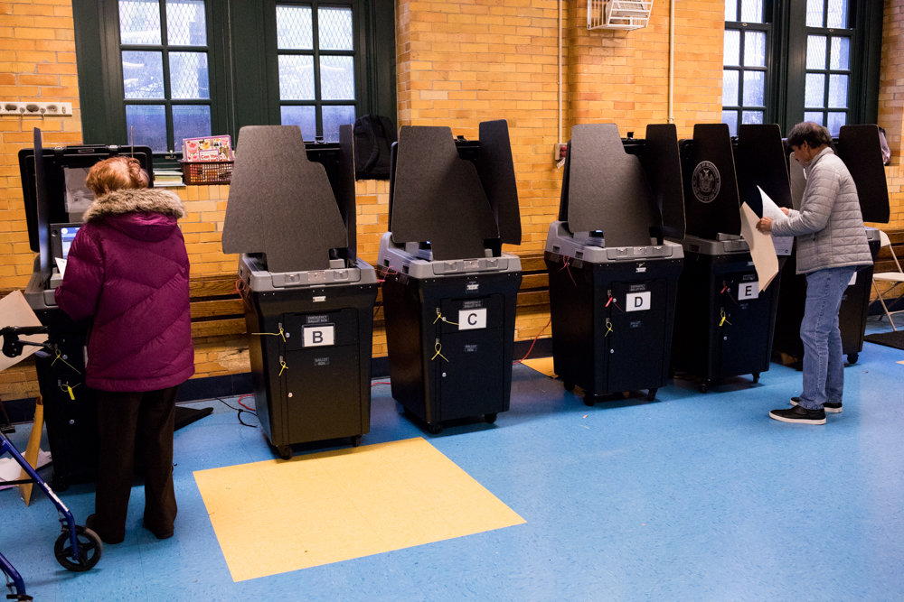 By the early afternoon on Election Day, only two of six ballot scanners were working at P.S. 81 Robert J. Christen School on Riverdale Avenue, where the line of voters snaked around the room with people waiting to scan their ballots.