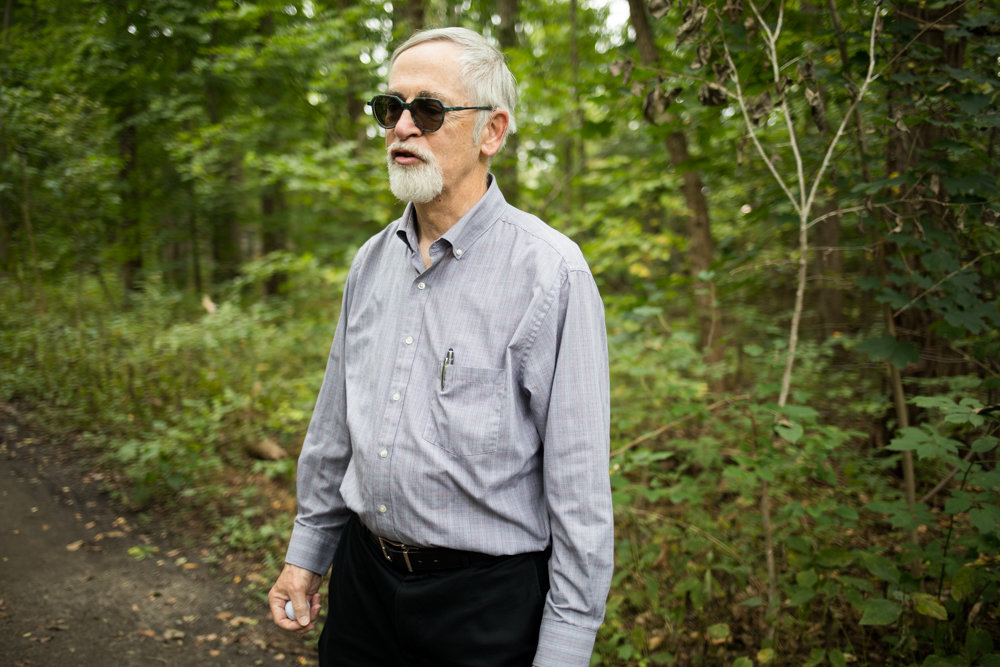 Manhattan College professor William Merriman has trotted along the Old Putnam Trail in Van Cortlandt Park three times a week for 30 years. He opposes a plan to pave a large section of the trail, preferring instead a soft surface. ‘I feel like when I’m walking here, I’m in the country.’