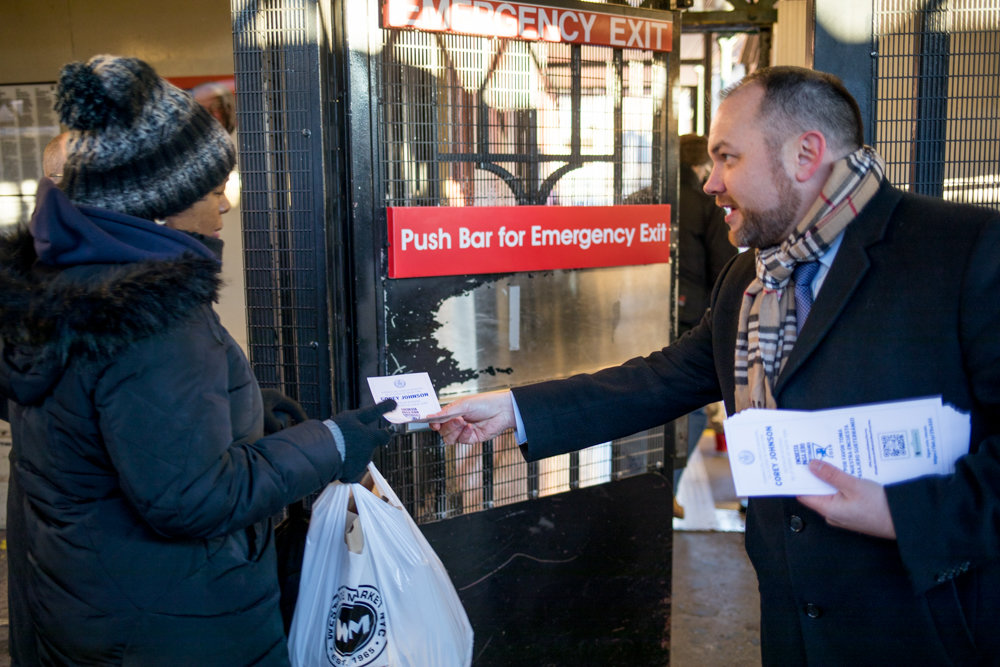 City council Speaker and acting public advocate Corey Johnson hands out a survey to a commuter leaving the uptown 1 train platform at West 238th Street on the last day of his five-borough transit tour Jan. 11. Johnson and other local elected officials led the initiative to better understand commuter plights and how they could fix them.
