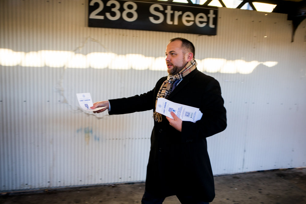 With surveys in hand, city council speaker and acting public advocate Corey Johnson walks towards commuters disembarking from an uptown 1 train at West 238th Street. Johnson and other local elected officials conducted a transit tour to better understand how commuters feel about the MTA.