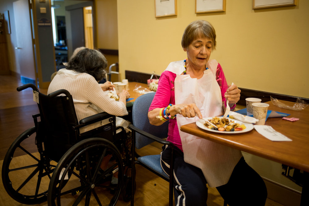 Jacquline Arafa feasts on a waffle with all the trimmings at the Hebrew Home at Riverdale. Arafa was delighted to chow down on the classic breakfast staple. The Hebrew Home served the waffles, in part, to evoke childhood memories for patients with dementia or Alzheimer’s.
