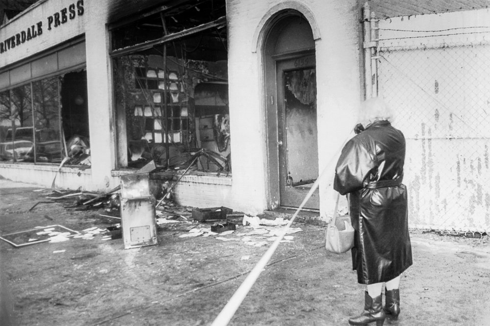 Celia Stein surveys the damage wrought by a firebombing at the Broadway office of The Riverdale Press. The Feb. 28, 1989, attack came days after an editorial defending bookstores’ rights to sell Salman Rushdie’s ‘The Satanic Verses,’ a critically praised but widely controversial novel. Stein founded The Press with her husband
David Stein in 1950, and the Broadway location was a source of pride for the couple when they first purchased it in 1967.