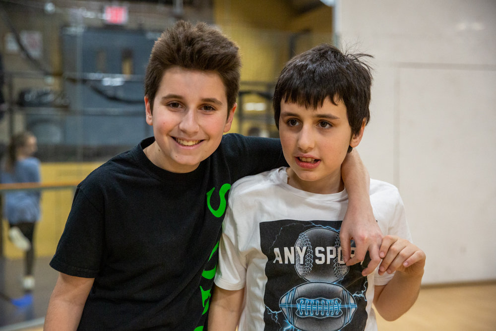 David Shapiro, left, here with his younger autistic brother Efraim, is the mastermind behind Inclusion Basketball, a program designed to benefit children with disabilities.