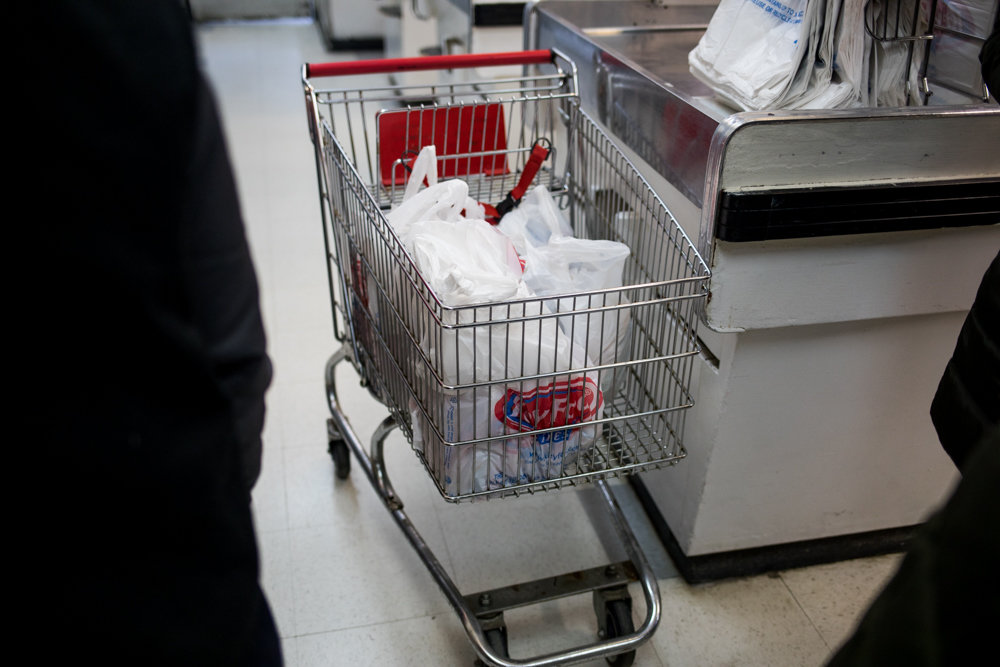 Groceries in plastic bags sit in a cart in Key Food on Riverdale Avenue. Single-use plastic bags are set to become a rarity in the state as lawmakers have approved a ban on them as part of the new state budget. The ban is expected to go into effect next March, and will give counties the option to impose a 5-cent fee on paper bags.