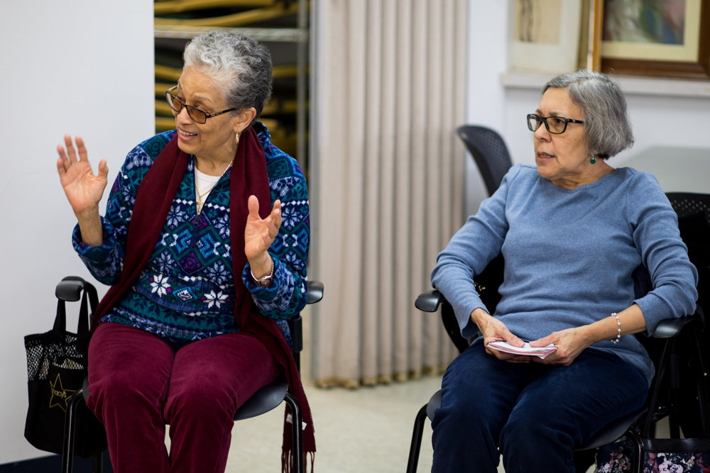 Mary Fernandez, left, talks during a meeting of the Savvy Solos Club at RSS-Riverdale Senior Services. The recently created club provides a forum for RSS members to share issues that matter to them.