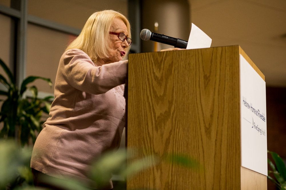 Hebrew Home resident Zelda Fassler reads an original poem during 'Write Me,' a poetry event in remembrance of the Holocaust.