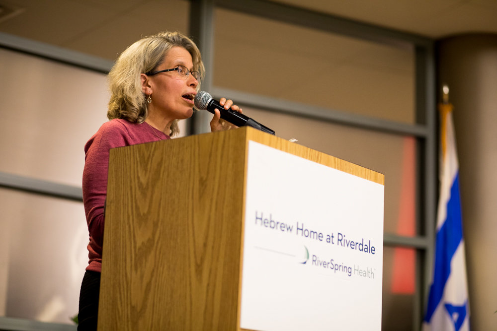 Sarah Stern of Spuyten Duyvil reads a poem from her book, 'We Have Been Lucky in the Midst of Misfortune,' during 'Write Me,' a poetry event in remembrance of the Holocaust at the Hebrew Home at Riverdale.