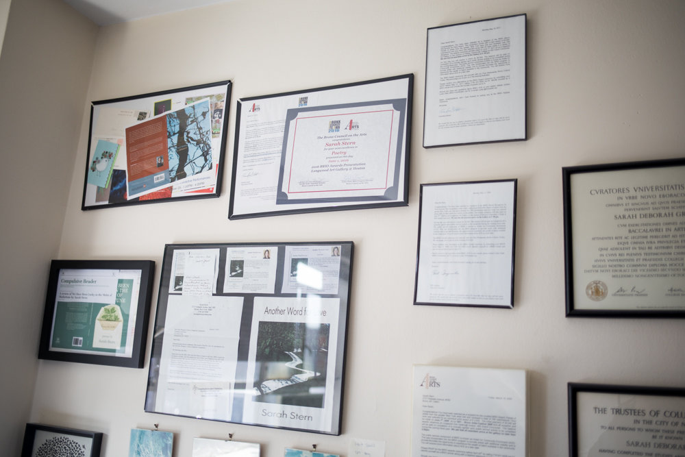 Sarah Stern has a wall of awards and recognition above the desk where she often works on her poems. Her latest poetry book, 'We Have Been Lucky in the Midst of Misfortune,' was published in December.