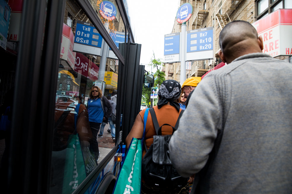 Commuters slowly board a Bx7 bus at West 231st Street and Riverdale Avenue.