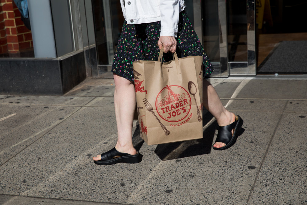 A customer leaves Trader Joe’s with bags of groceries at the chain’s location on Broadway and West 72nd Street. A coalition of residents has clamored for Trader Joe’s to replace the beleaguered Key Food at the Sky View Shopping Center in North Riverdale.