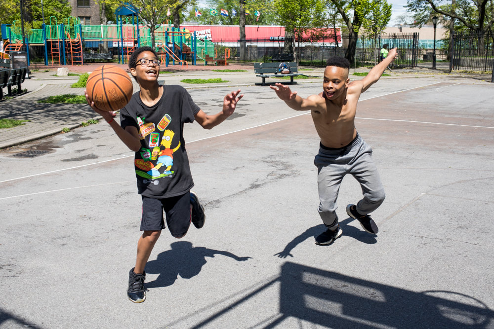 Eric Garcia, left, and Isaiah Pagan play ‘king of the court’ at Fort Four Park.