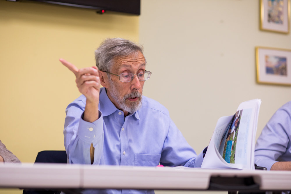 Bob Bender reads from the minutes of an MTA board meeting during Community Board 8’s special greenway committee’s first meeting of 2019. Bender believes the MTA is required to take measures to combat the effects of climate change that would align with the goals of the greenway project.