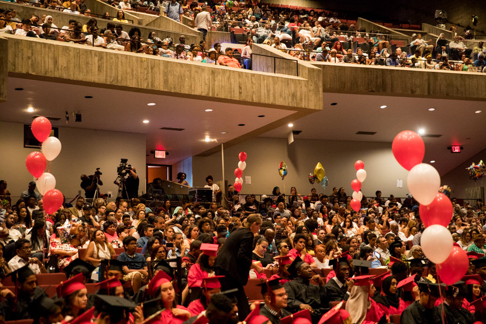 Students, family and friends pack an auditorium at Lehman College for DeWitt Clinton High School’s ceremony graduating the Class of 2019.