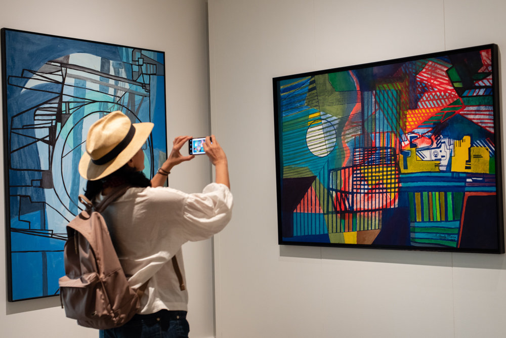 Deborah Cavalcanti, who hails from the Brazilian city of Fortaleza, takes a picture of one of Roberto Burle Marx's paintings at the New York Botanical Garden. An exhibition of his work, 'Brazilian Modern: The Living Art of Roberto Burle Marx,' is on display at the garden through Sept. 29.