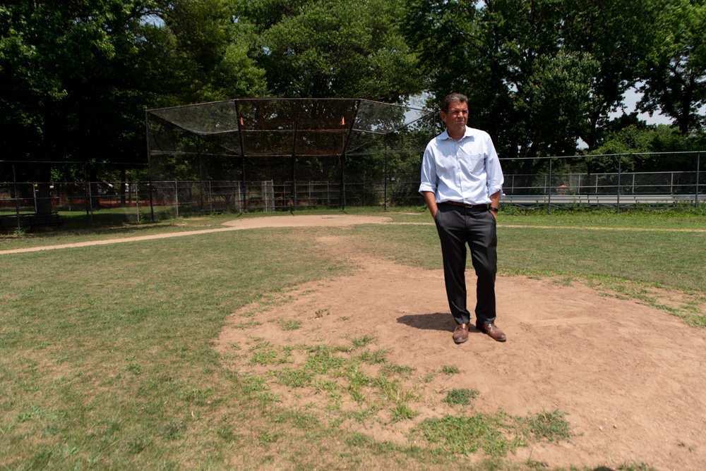 Rob Walsh, senior advisor to Manhattan College’s president, takes in the view of the ballfield in Van Cortlandt Park. Walsh wants the city to renovate the field, restoring it to its former glory.