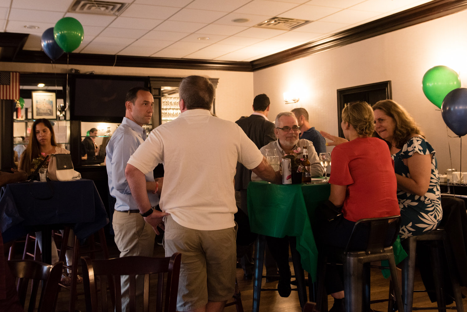 City council candidate Dan Padernacht, center left, chats with supporters during a fundraising event for his campaign at Downey’s Bar & Grill. Padernacht hopes to claim the seat currently occupied by Councilman Andrew Cohen, and a matching public funds program for political candidates may help him get there in 2021.