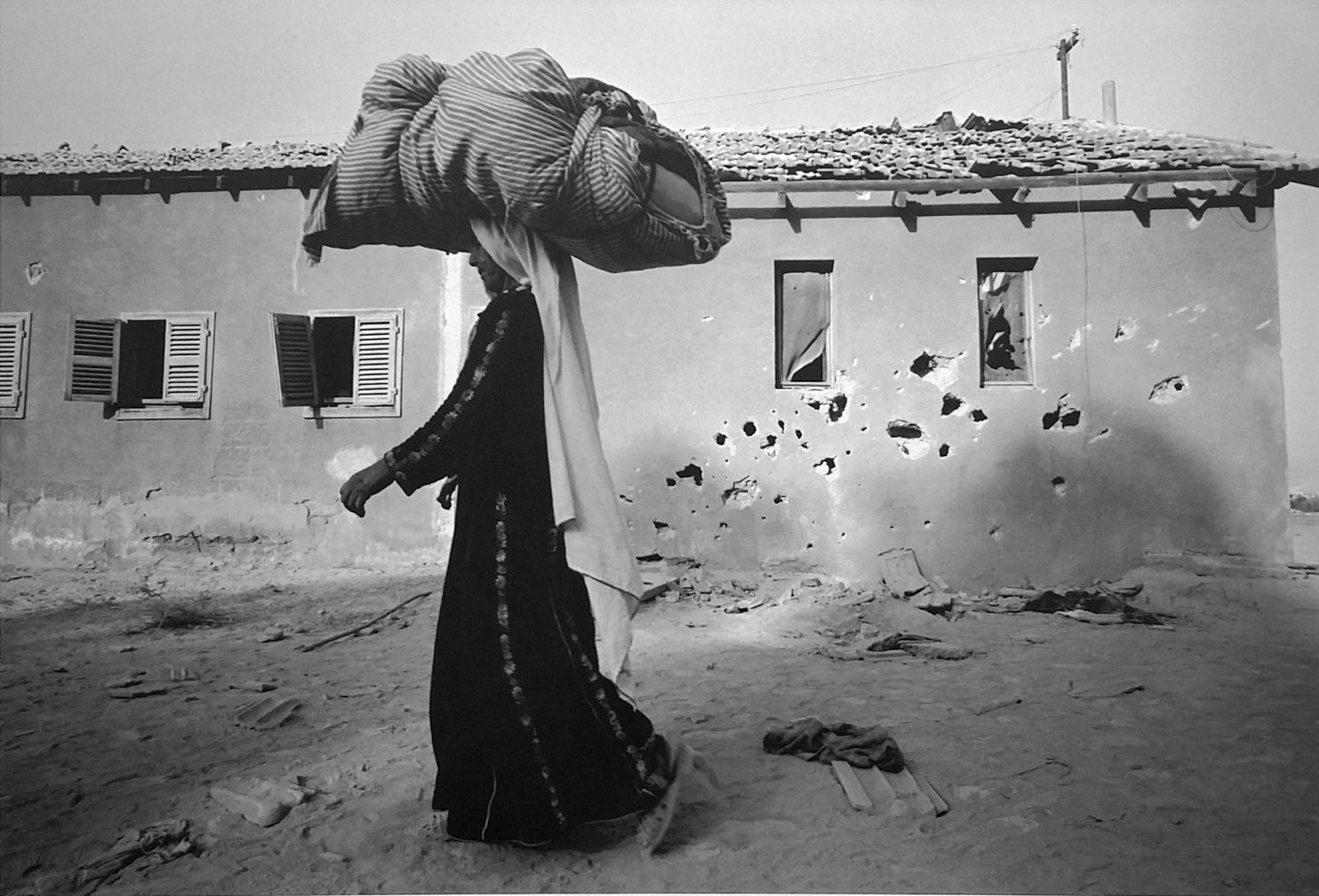 Leonard Freed photographed a refugee woman walking toward the Allenby Bridge that crosses the Jordan River near Jericho in 1967. This image is included in the exhibition ‘Leonard Freed: Israel Magazine 1967-1968,’ on display at the Hebrew Home at Riverdale’s Derfner Judaica Museum through Jan. 5.
