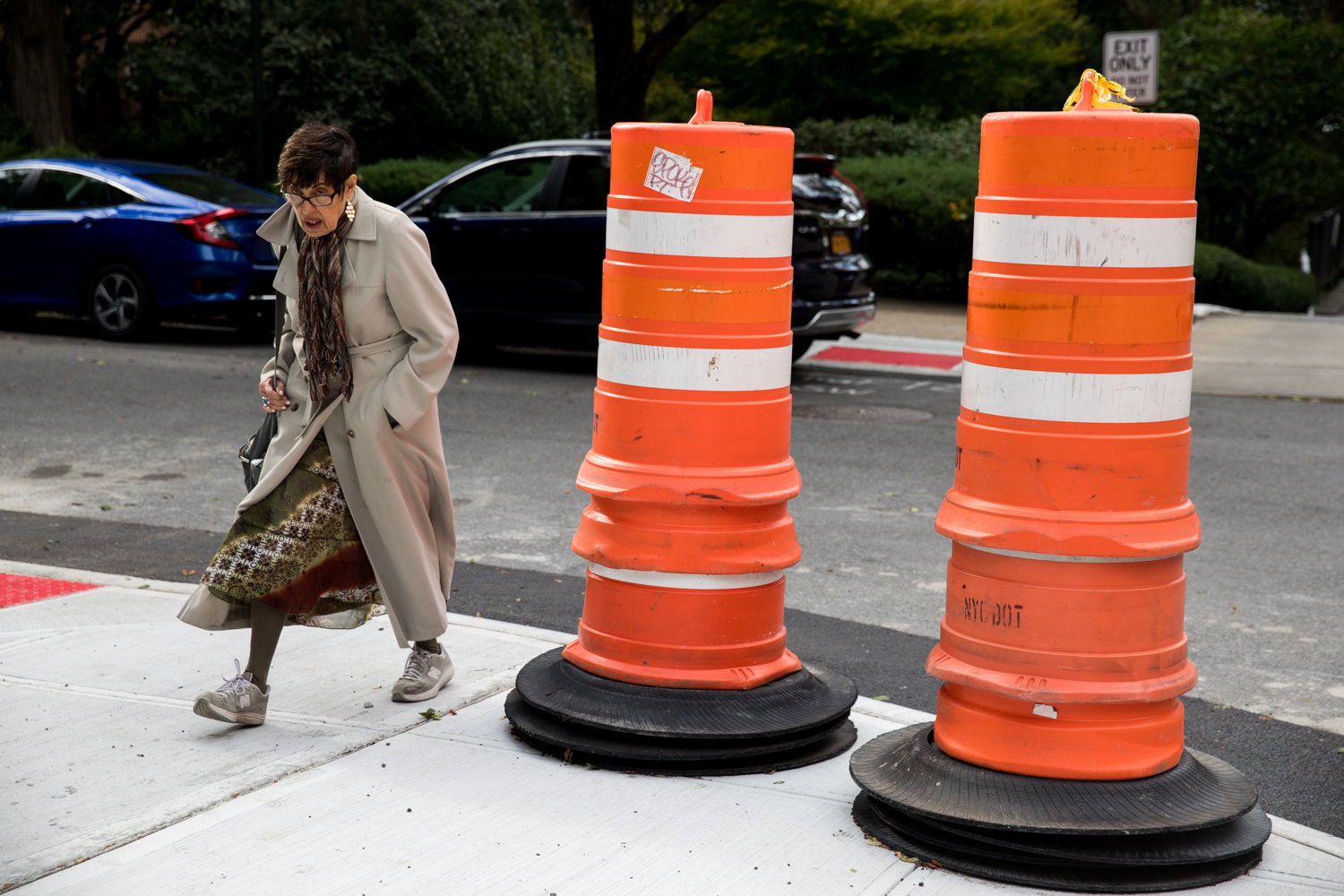 A pedestrian walks onto Kappock Street after crossing Palisade Avenue. The transportation department is extending curbs at intersections like this to narrow crosswalks.