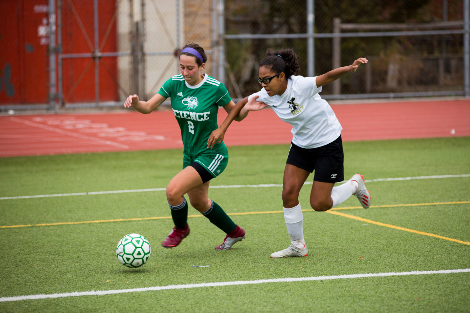Bronx Science senior Sofia Mahairas makes her way around a McKee defender in the Wolverines’ second-round playoff victory over the Seagulls.