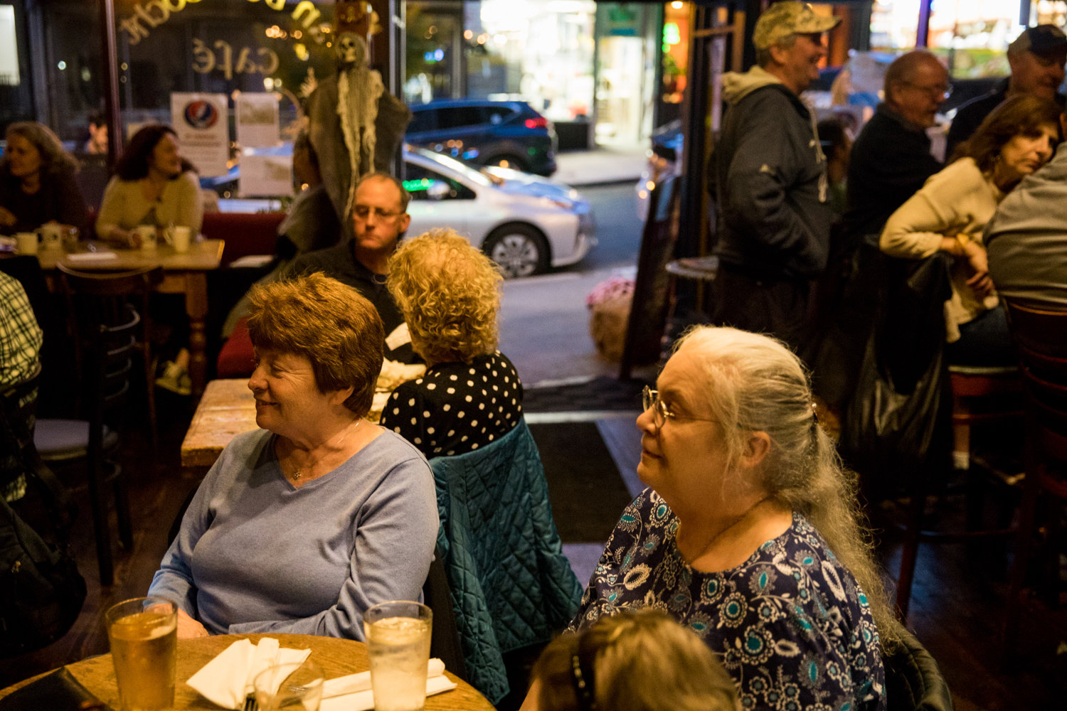 Patrons at An Beal Bocht Cafe listen to the musical stylings of Mary Courtney, a longtime regular performer at the West 238th Street establishment.