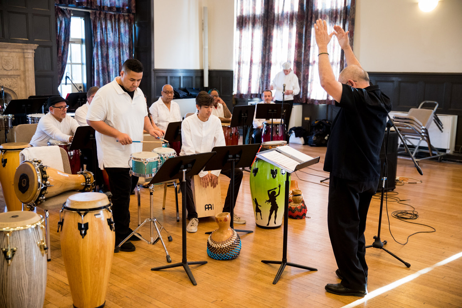 Victor Rendón conducts a piece performed by Carlos Colon, left, and Adam Baksh during a Nov. 21 concert by the Lehman College Percussion Ensemble as part of the school’s jazz festival.