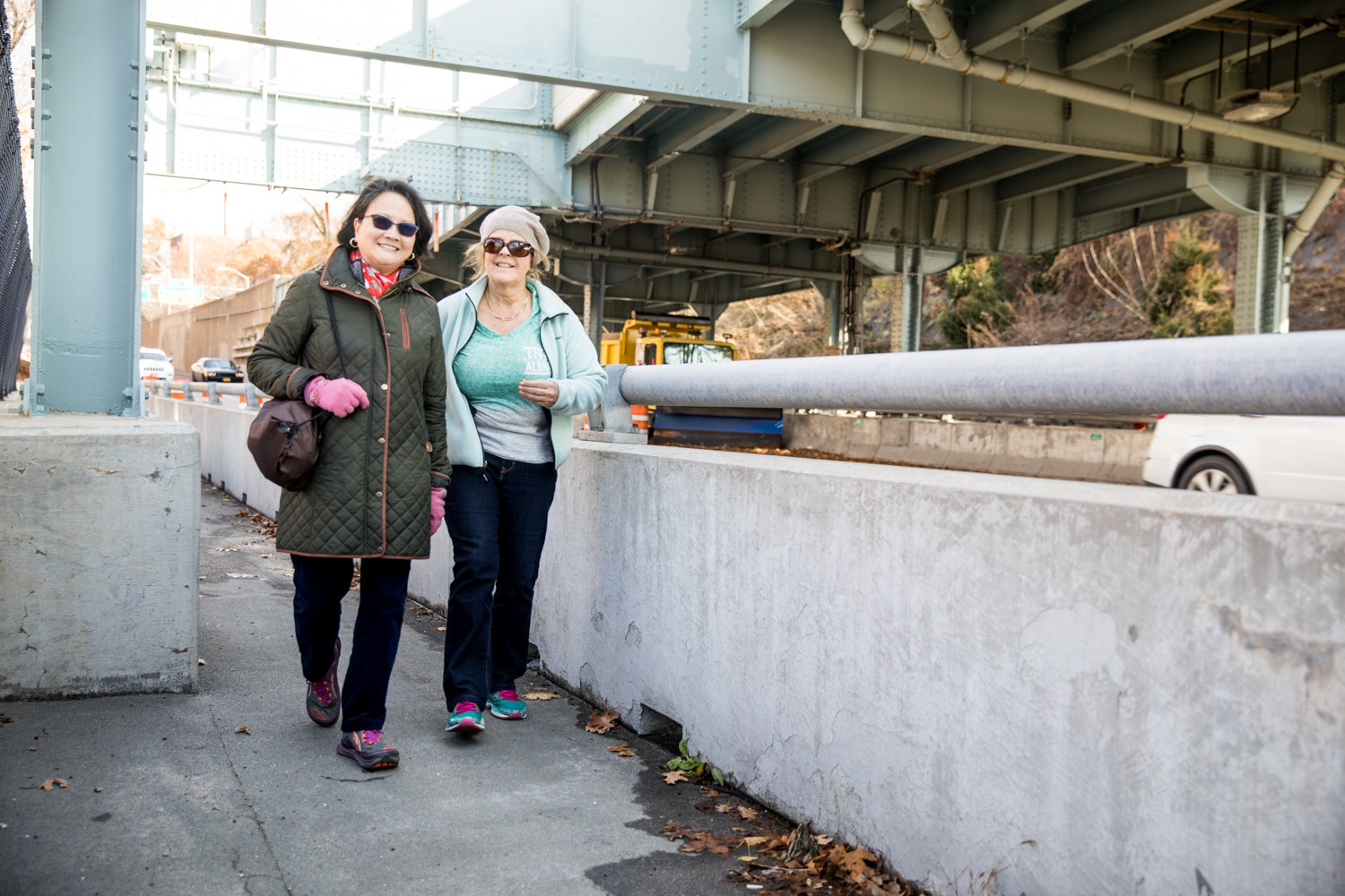 Sherrie Lem, left, and Melissa Schori walk toward Manhattan via the pedestrian walkway on the Henry Hudson Bridge. Lem and Schori are thrilled the walkway is open after being closed for more than a year.