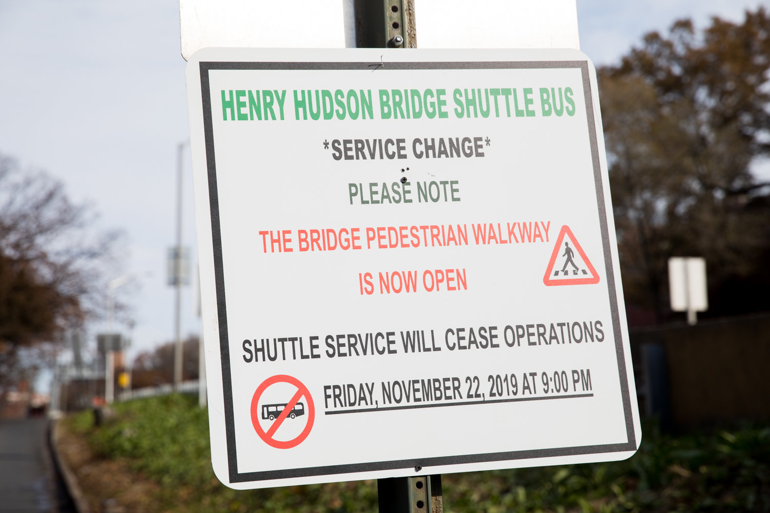 A sign informs pedestrians the free shuttle service between Spuyten Duyvil and Manhattan is no longer operating now that the Henry Hudson Bridge’s pedestrian walkway is open again.