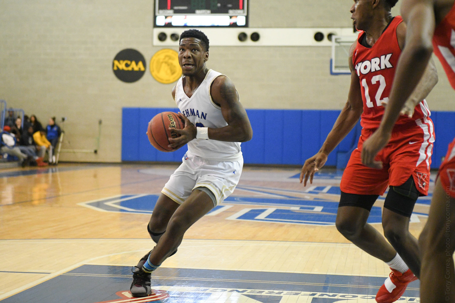 Lehman College junior guard Isaiah Geathers slices through a couple of York defenders during the Lightning’s 91-64 victory last Friday night.