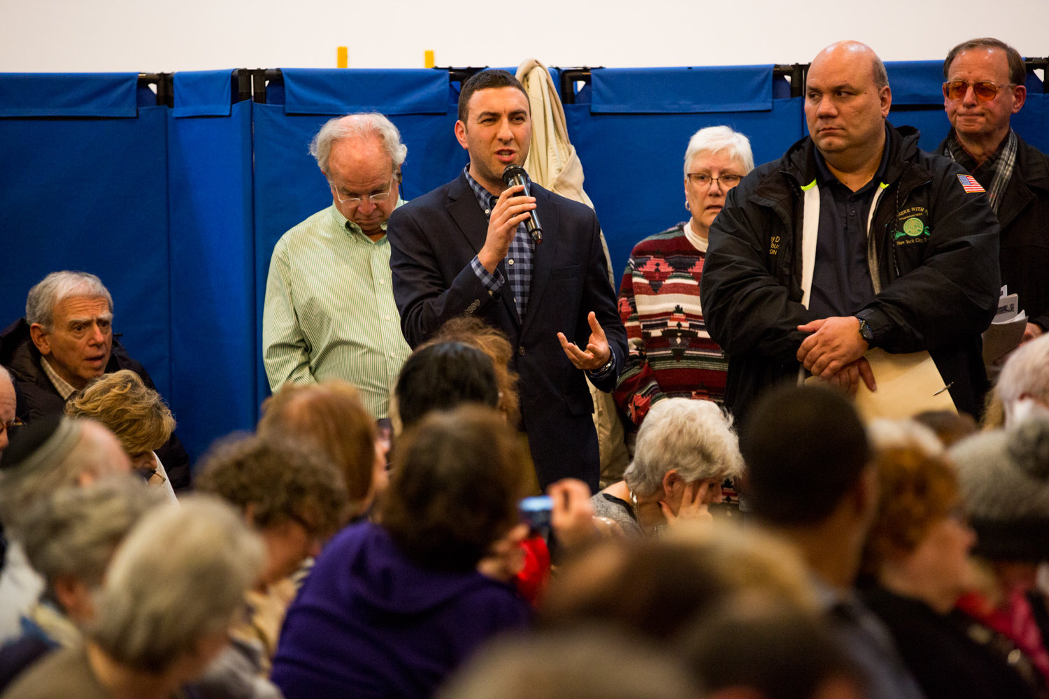 City council candidate Eric Dinowitz alleges the proposed cuts to express bus service are a form of age discrimination during a Nov. 18 community meeting with Metropolitan Transportation Authority officials organized by his father, Assemblyman Jeffrey Dinowitz.