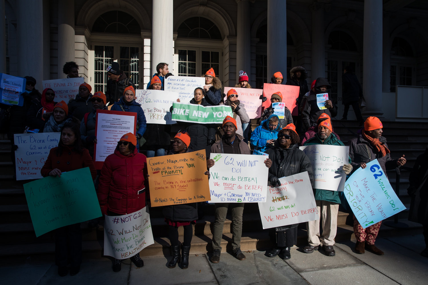 Members of Bronx Health Reach and other advocacy groups hold a rally on the steps of city hall as part of Not 62 earlier this month. For the second year in a row, the Bronx came last out of all the counties statewide when it comes to health.