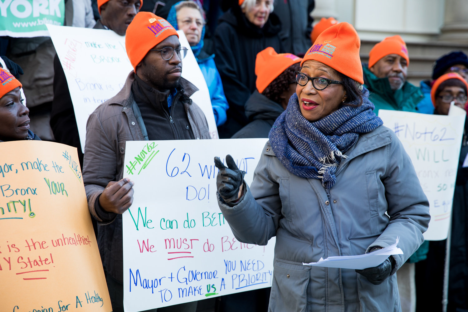 Bronx Health Reach project director Charmaine Ruddock speaks at the start of rally as part of Not 62 on Dec. 3. The rally’s name refers to Bronx County’s ranking among New York’s 62 counties when it comes to health in the state. .