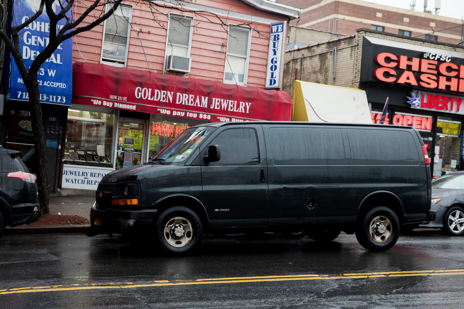 A van is double-parked on West 231st Street just off Broadway. The northwest Bronx is a hotbed of parking problems.