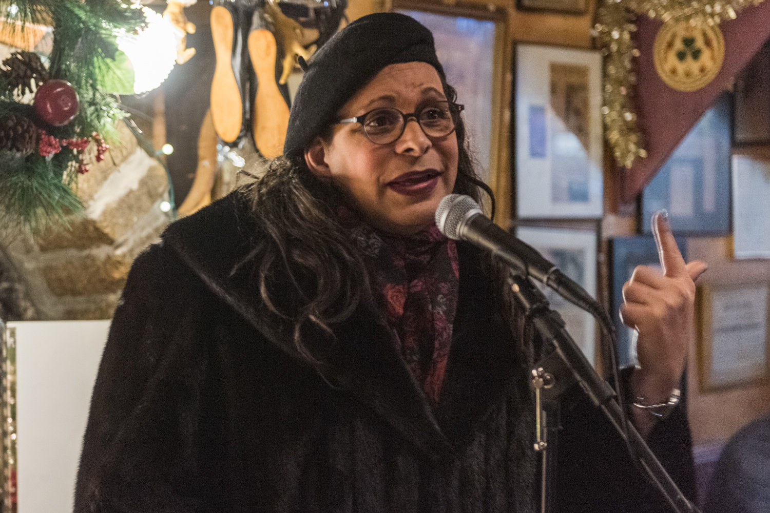 Jocelyn Carlisle performs a poem at a Dec. 11 reading marking the 10-year anniversary of the Poor Mouth Writer’s Night at An Beal Bocht Cafe.