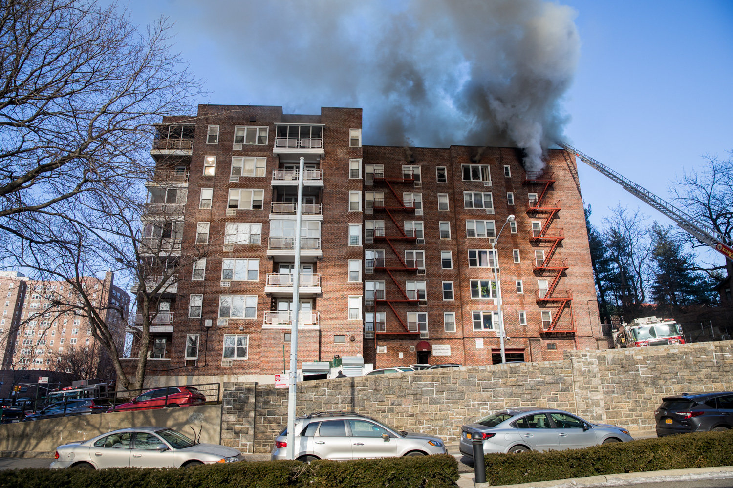 Billowing smoke casts a shadow over 601 Kappock St., where a fire broke out Tuesday morning. The three-alarm blaze drew more than 100 emergency personnel. No injuries were reported aside from a minor one sustained by a firefighter.