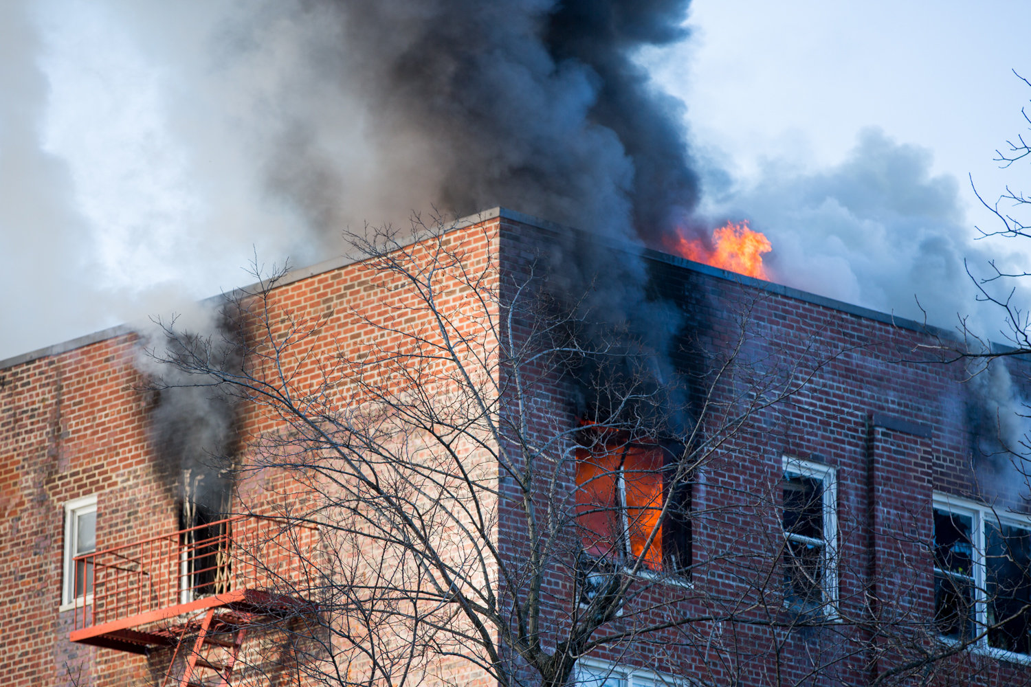 A fire rages in a sixth-floor apartment at 601 Kappock St. Firefighters contained the three-alarm blaze, which resulted in no injuries to residents.