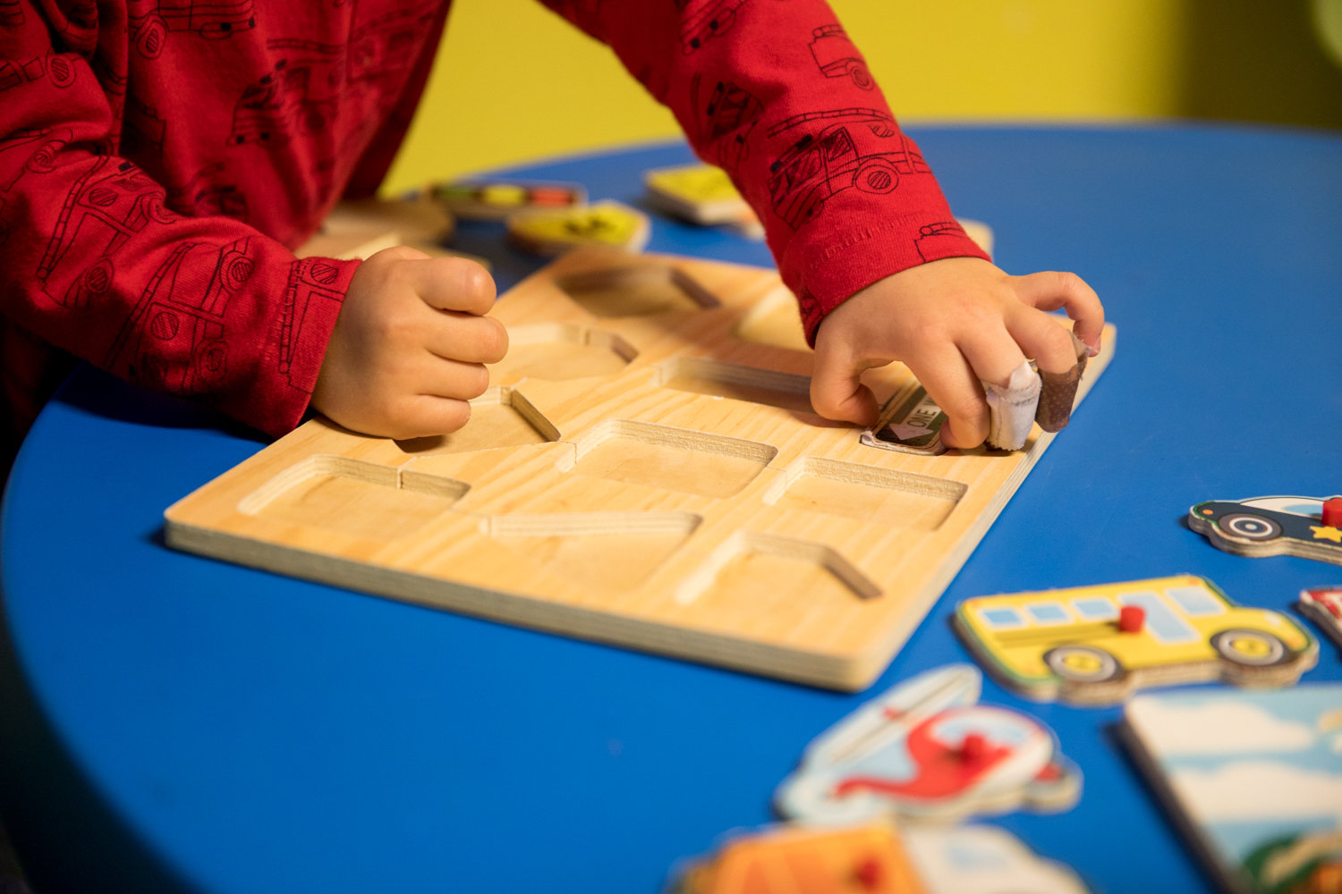 A child figures out a puzzle at Rodi Daycare Center on Netherland Avenue.