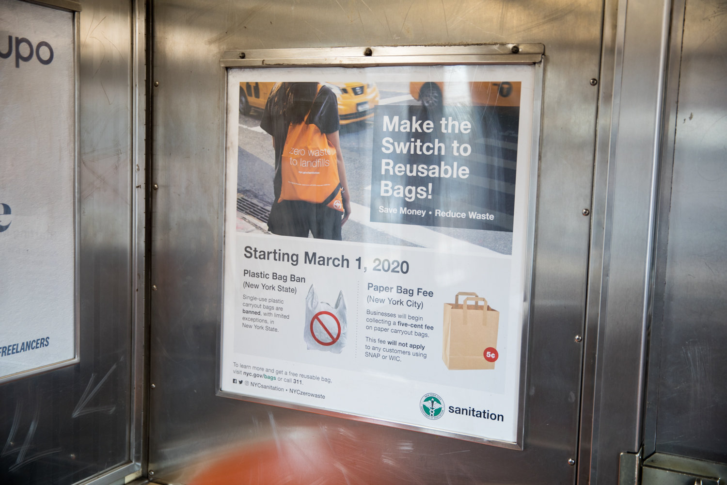 A sanitation department poster on a 1 train encourages people to make reusable bags a part of their daily lives, since plastic bags will soon be banned — with some exceptions — starting March 1.