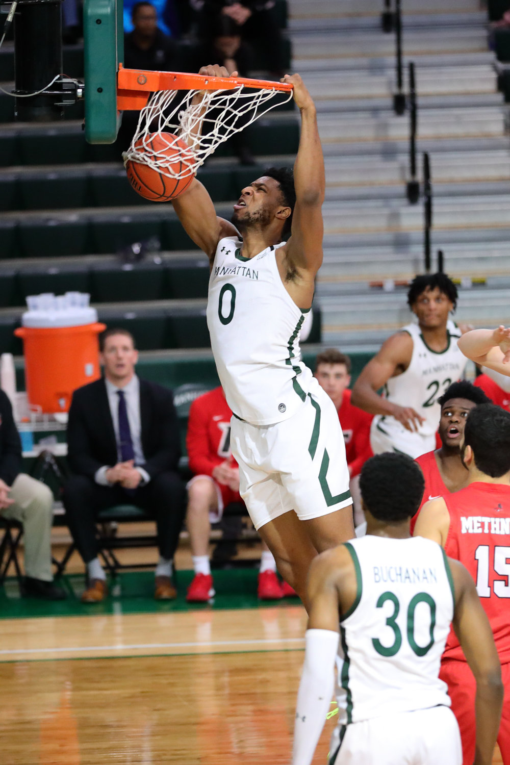 Manhattan sophomore Warren Williams slams home two of his four points during the Jaspers’ 66-50 loss to Fairfield on Senior Night last Friday.