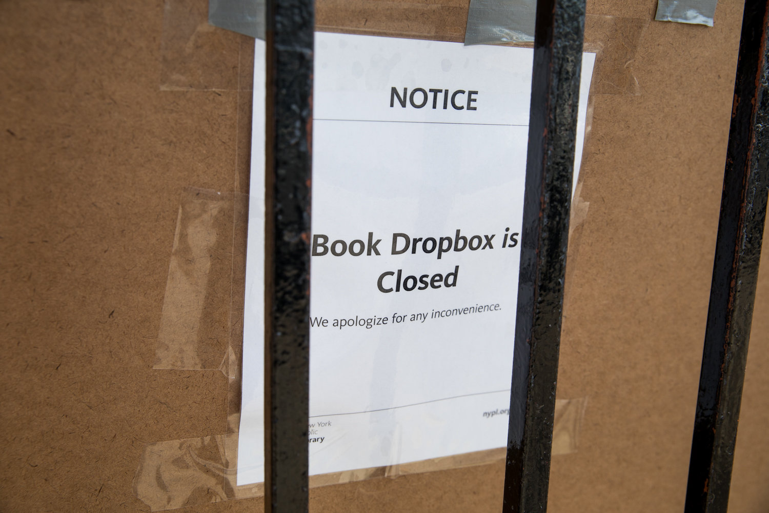 A sign informs passersby that the Riverdale Library’s book drop is temporarily closed.