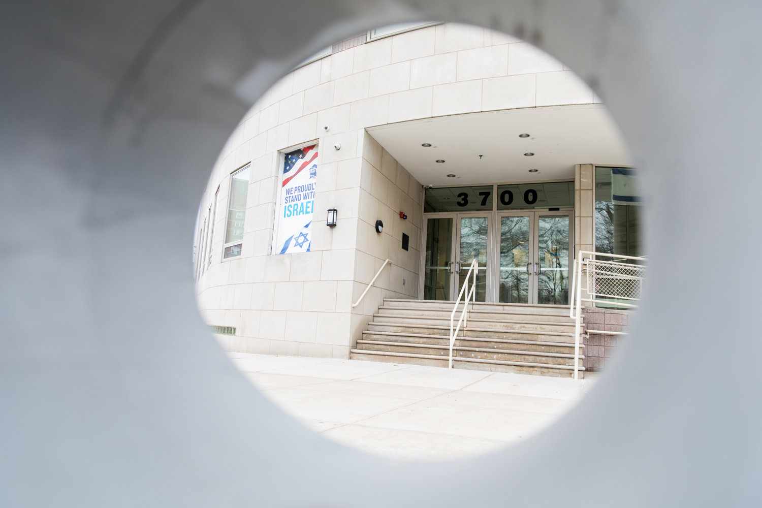 The entrance to the Hebrew Institute of Riverdale is seen through a barrier. The synagogue wants to install 25 steel protective bollards around its entrance.